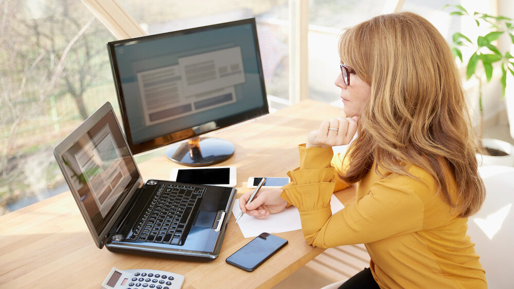 Financial advisor at work looking at statistics